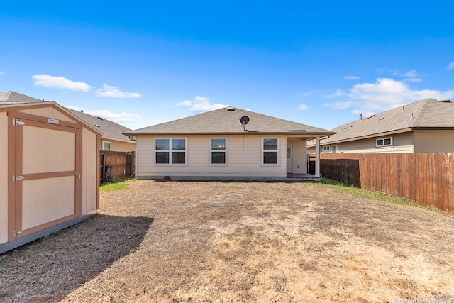 8926 Double Oak, San Antonio, TX 78254 - rear view of property featuring a shed, a fenced backyard, and an outdoor structure