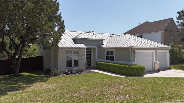 8418 Hera, Universal City, TX 78148 - view of front of house with a standing seam roof, metal roof, fence, and a front lawn