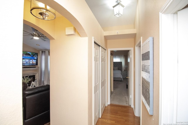 8418 Hera, Universal City, TX 78148 - hall with arched walkways and wood finished floors
