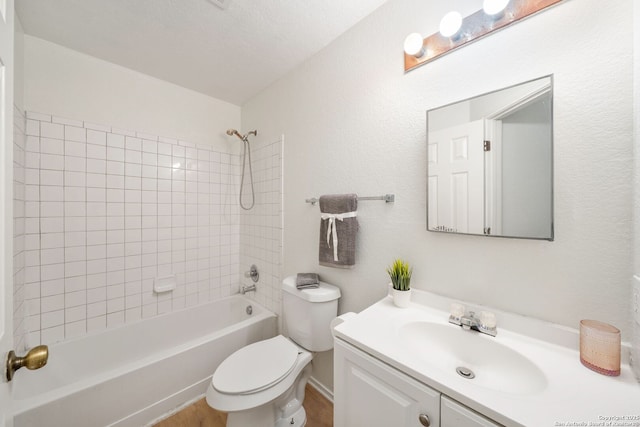 bathroom featuring shower / bath combination, vanity, toilet, and wood finished floors