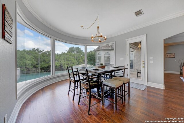 25204 Wentworth, San Antonio, TX 78260 - dining space featuring a chandelier, dark wood-type flooring, crown molding, and baseboards