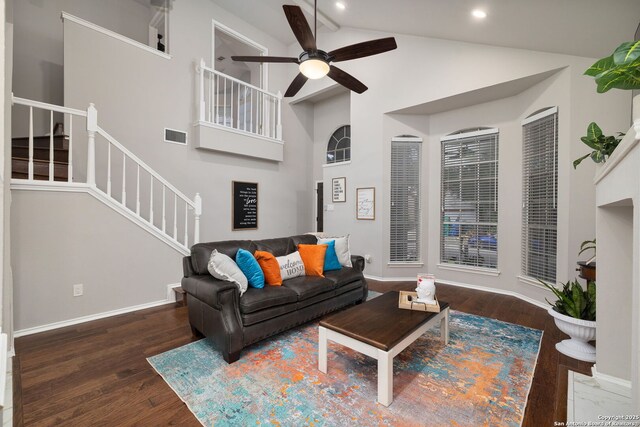 7507 Silent Cloud, San Antonio, TX 78250 - living area with a ceiling fan, wood finished floors, stairs, beam ceiling, and baseboards