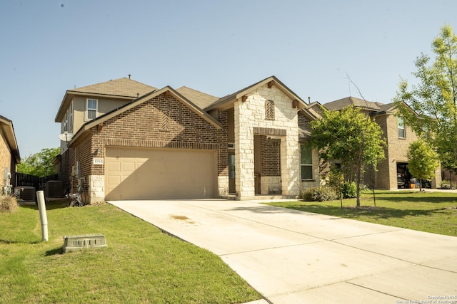 13511 Pickett, San Antonio, TX 78254 - view of front facade with central air condition unit, driveway, a front lawn, brick siding, and a garage