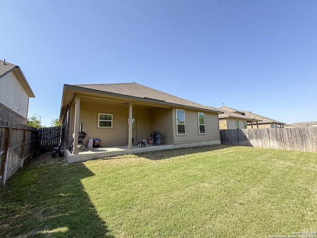 13511 Pickett, San Antonio, TX 78254 - back of house featuring a patio, a fenced backyard, and a lawn