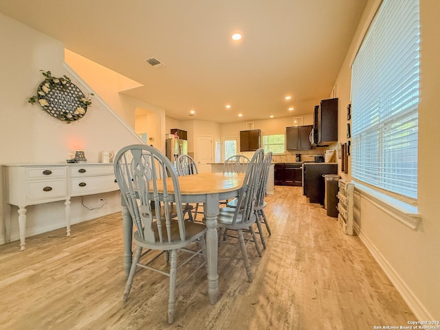 13511 Pickett, San Antonio, TX 78254 - dining space featuring light wood-style floors, baseboards, and visible vents