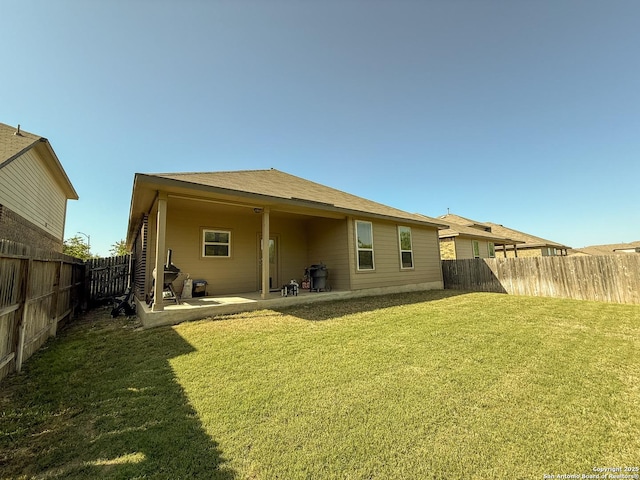 13511 Pickett, San Antonio, TX 78254 - rear view of property with a patio area, a fenced backyard, and a lawn