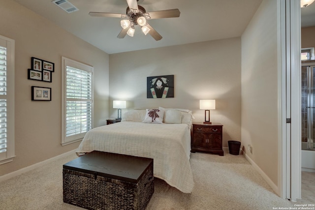 bedroom featuring visible vents, baseboards, ceiling fan, and carpet floors