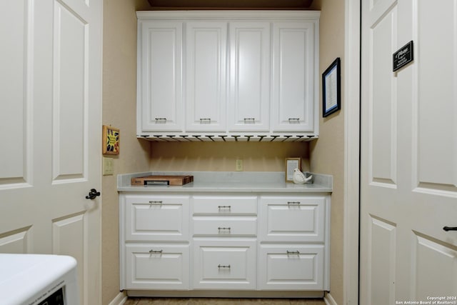 washroom featuring baseboards and laundry area