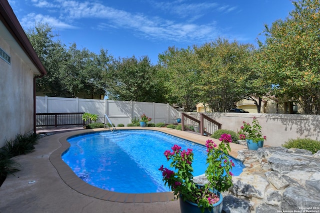 view of pool with a fenced backyard and a fenced in pool