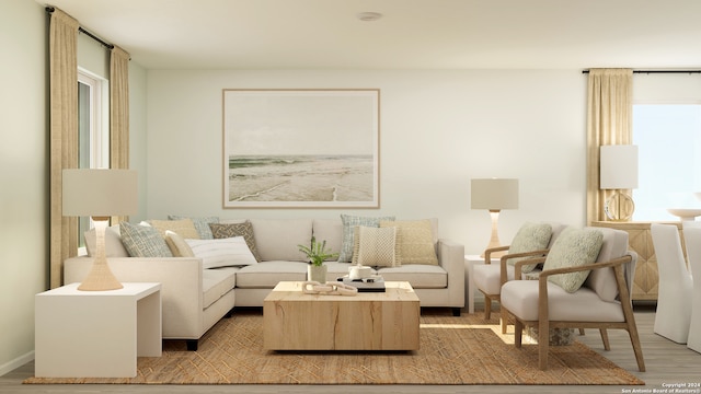 living area with a wealth of natural light and light wood-style floors