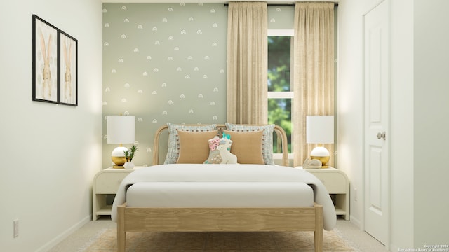 bedroom featuring light colored carpet and baseboards