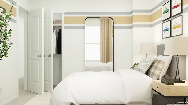 bedroom with baseboards and carpet flooring