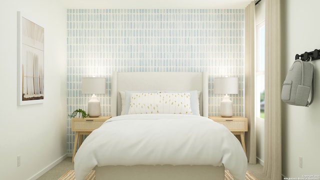 bedroom with baseboards and carpet