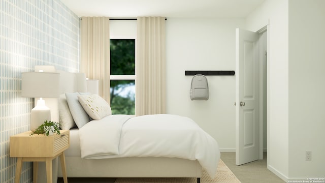 bedroom with baseboards and carpet floors