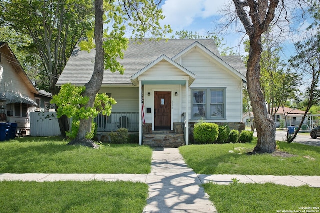 636 W Hollywood Ave, San Antonio, TX 78212 - bungalow featuring a shingled roof, covered porch, and a front lawn