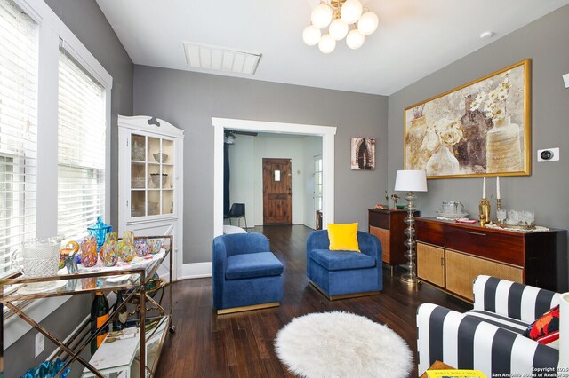 636 W Hollywood Ave, San Antonio, TX 78212 - living area with visible vents, an inviting chandelier, and wood finished floors