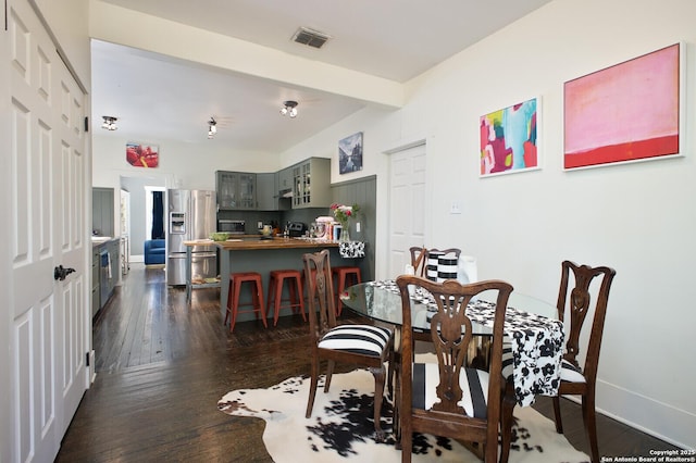 636 W Hollywood Ave, San Antonio, TX 78212 - dining room featuring visible vents, baseboards, and dark wood-style floors