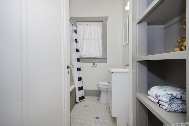 636 W Hollywood Ave, San Antonio, TX 78212 - bathroom with toilet, tile patterned floors, shower / bathtub combination with curtain, and vanity