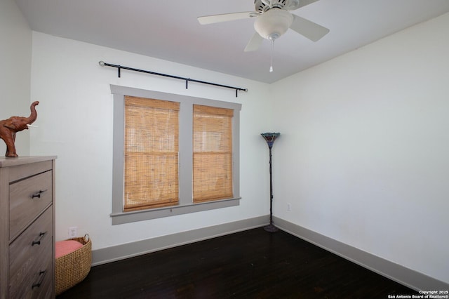 636 W Hollywood Ave, San Antonio, TX 78212 - unfurnished room with dark wood-type flooring, baseboards, and a ceiling fan