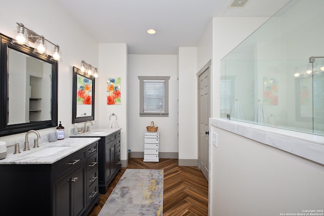 636 W Hollywood Ave, San Antonio, TX 78212 - full bath with two vanities, a sink, visible vents, and walk in shower