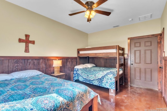 723 Tierra Linda, Concan, TX 78838 - bedroom with visible vents, ceiling fan, and finished concrete floors
