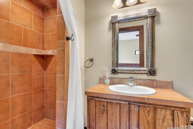 723 Tierra Linda, Concan, TX 78838 - full bathroom with vanity and a tile shower