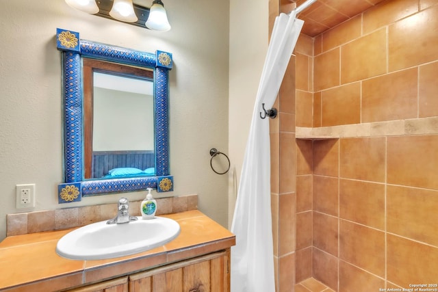 723 Tierra Linda, Concan, TX 78838 - full bathroom featuring a tile shower and vanity