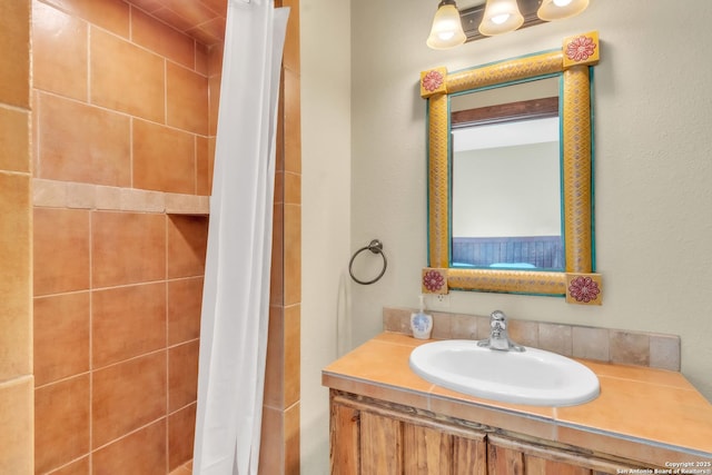 723 Tierra Linda, Concan, TX 78838 - bathroom featuring a tile shower and vanity