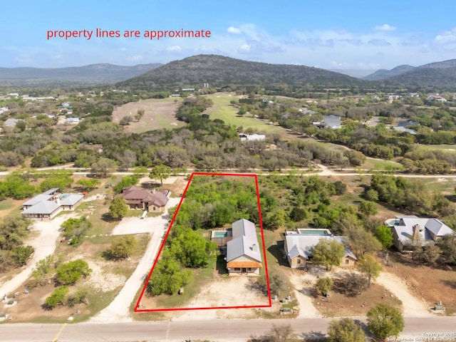 723 Tierra Linda, Concan, TX 78838 - birds eye view of property featuring a mountain view