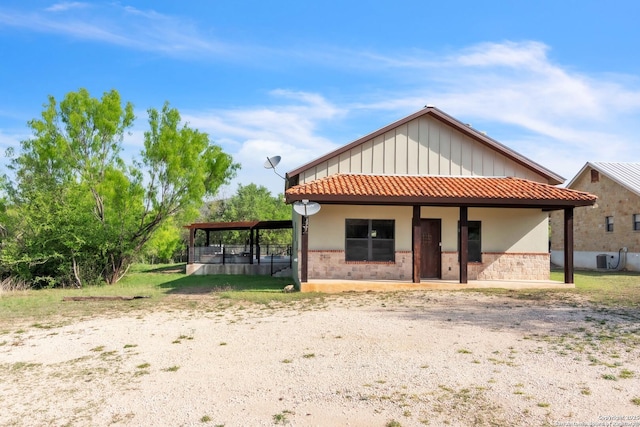 723 Tierra Linda, Concan, TX 78838 - back of house with a tile roof