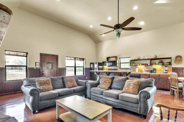 723 Tierra Linda, Concan, TX 78838 - living room featuring high vaulted ceiling, ceiling fan, recessed lighting, and a wainscoted wall