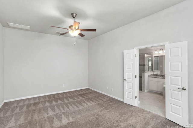 unfurnished bedroom featuring visible vents, baseboards, and carpet floors