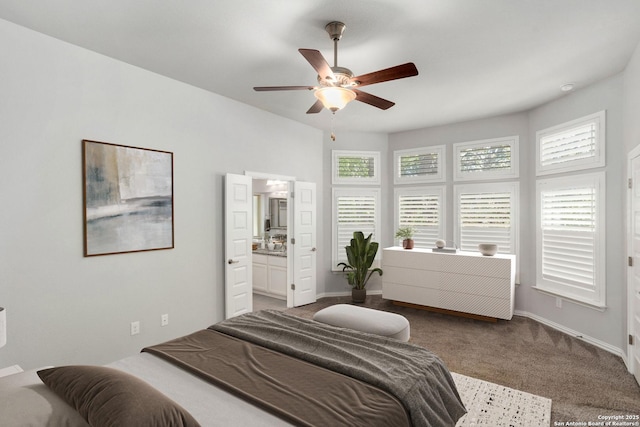 bedroom featuring carpet flooring, multiple windows, baseboards, and ceiling fan