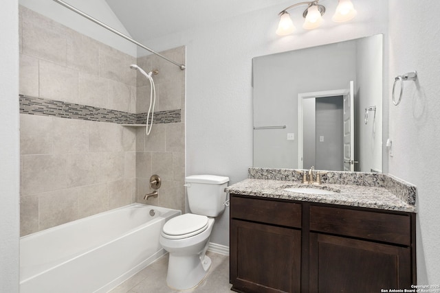 full bath with vanity, vaulted ceiling, tile patterned flooring,  shower combination, and toilet