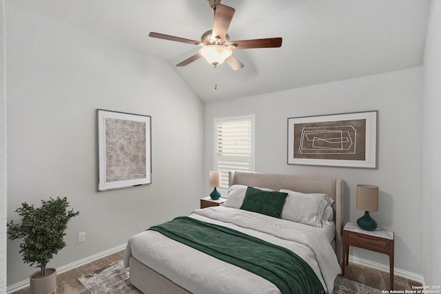 bedroom featuring baseboards, vaulted ceiling, a ceiling fan, and carpet floors