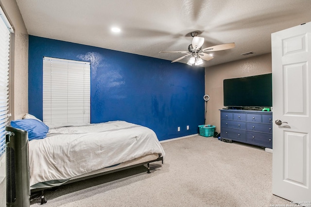 2230 Bedford Stage, San Antonio, TX 78213 - carpeted bedroom with visible vents, ceiling fan, and a textured wall
