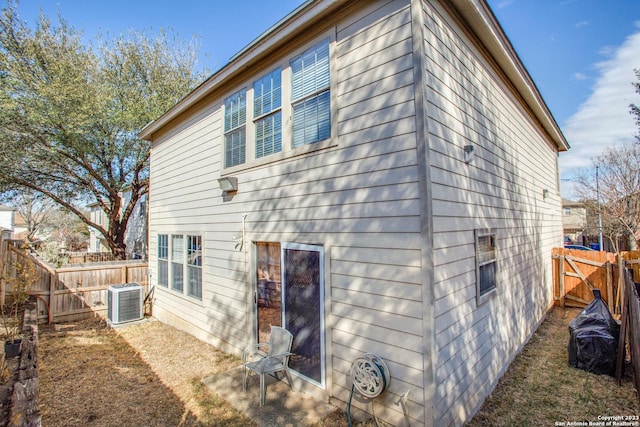 2230 Bedford Stage, San Antonio, TX 78213 - rear view of house featuring central AC unit and fence