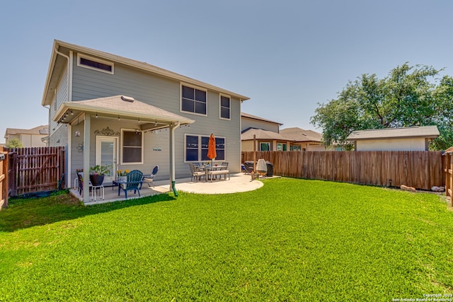 9737 Novacek, San Antonio, TX 78254 - rear view of property with a patio, a fenced backyard, and a lawn