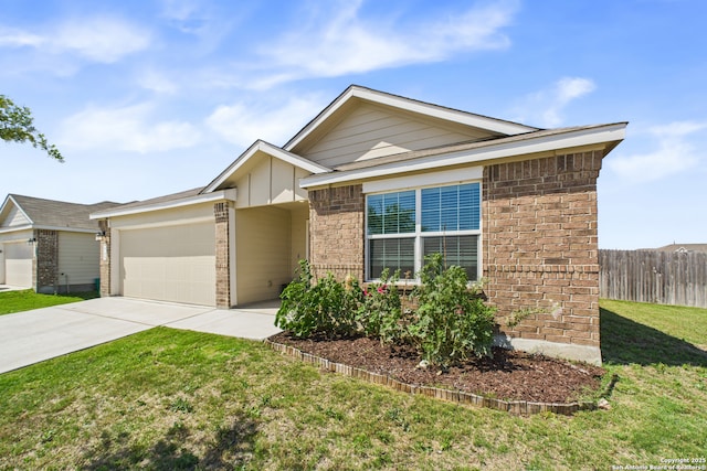 2700 La Mundial, Seguin, TX 78155 - view of front facade featuring driveway, a front yard, brick siding, a garage, and fence