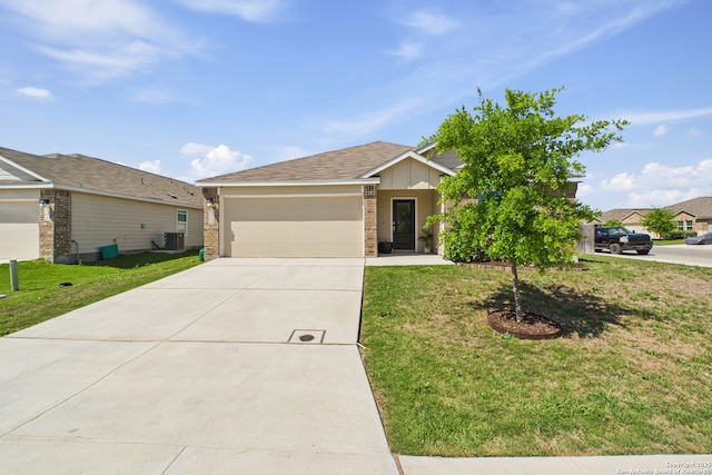 2700 La Mundial, Seguin, TX 78155 - view of front of home featuring brick siding, driveway, a front lawn, and a garage