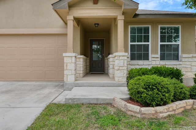 8732 Ironwood Hl, San Antonio, TX 78254 - doorway to property featuring an attached garage, concrete driveway, stucco siding, and stone siding