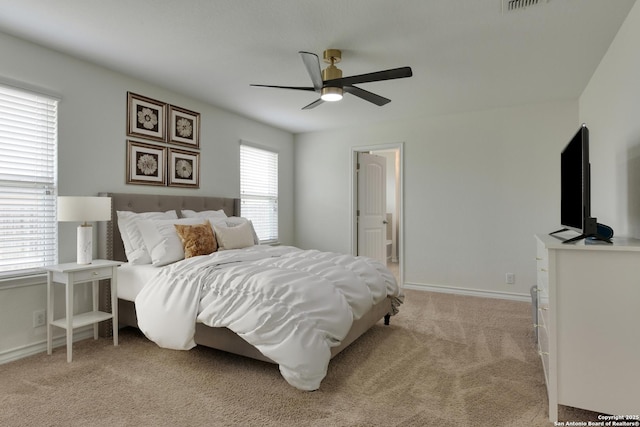 8732 Ironwood Hl, San Antonio, TX 78254 - bedroom with baseboards, visible vents, ceiling fan, and light colored carpet