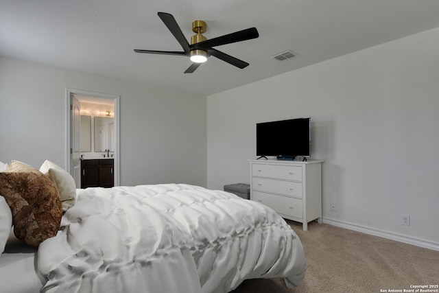 8732 Ironwood Hl, San Antonio, TX 78254 - bedroom featuring visible vents, baseboards, ensuite bathroom, light colored carpet, and a ceiling fan