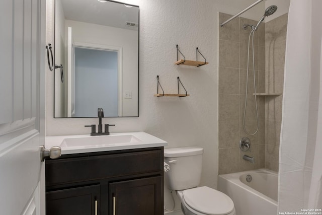 8732 Ironwood Hl, San Antonio, TX 78254 - bathroom featuring visible vents, shower / tub combo with curtain, a textured wall, vanity, and toilet
