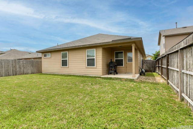 8732 Ironwood Hl, San Antonio, TX 78254 - rear view of property with a lawn, a fenced backyard, and a patio area