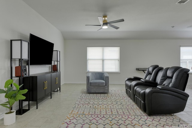 8732 Ironwood Hl, San Antonio, TX 78254 - living room with baseboards, ceiling fan, light tile patterned floors, and lofted ceiling