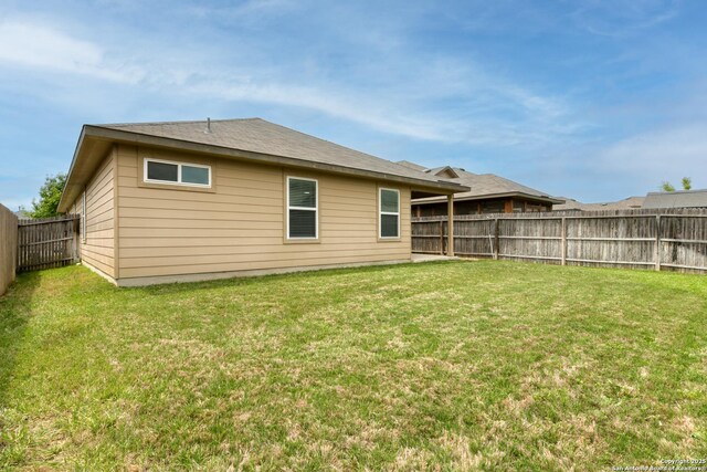 8732 Ironwood Hl, San Antonio, TX 78254 - back of house with a fenced backyard and a yard