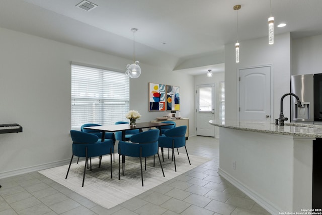 8732 Ironwood Hl, San Antonio, TX 78254 - dining space with light tile patterned floors, baseboards, and visible vents