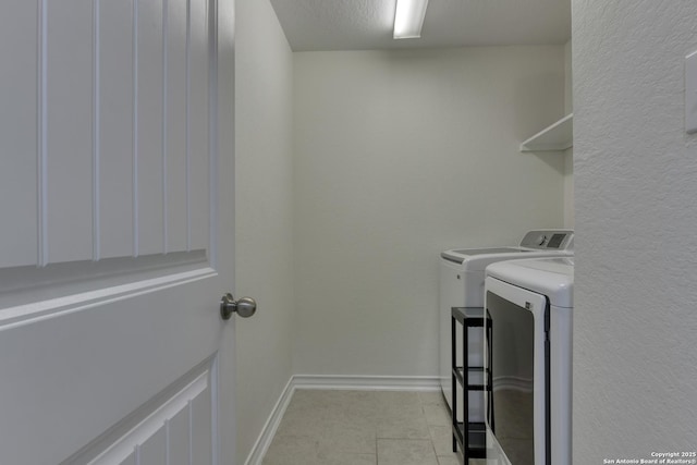 8732 Ironwood Hl, San Antonio, TX 78254 - washroom featuring baseboards, laundry area, light tile patterned flooring, and independent washer and dryer