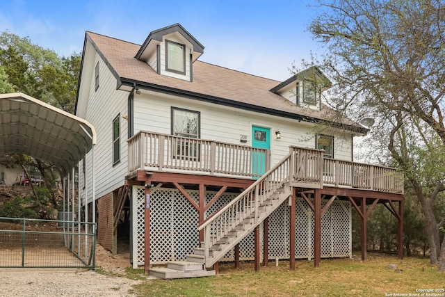 208 Woodridge, Canyon Lake, TX 78133 - rear view of house with a wooden deck, fence, a carport, and stairs